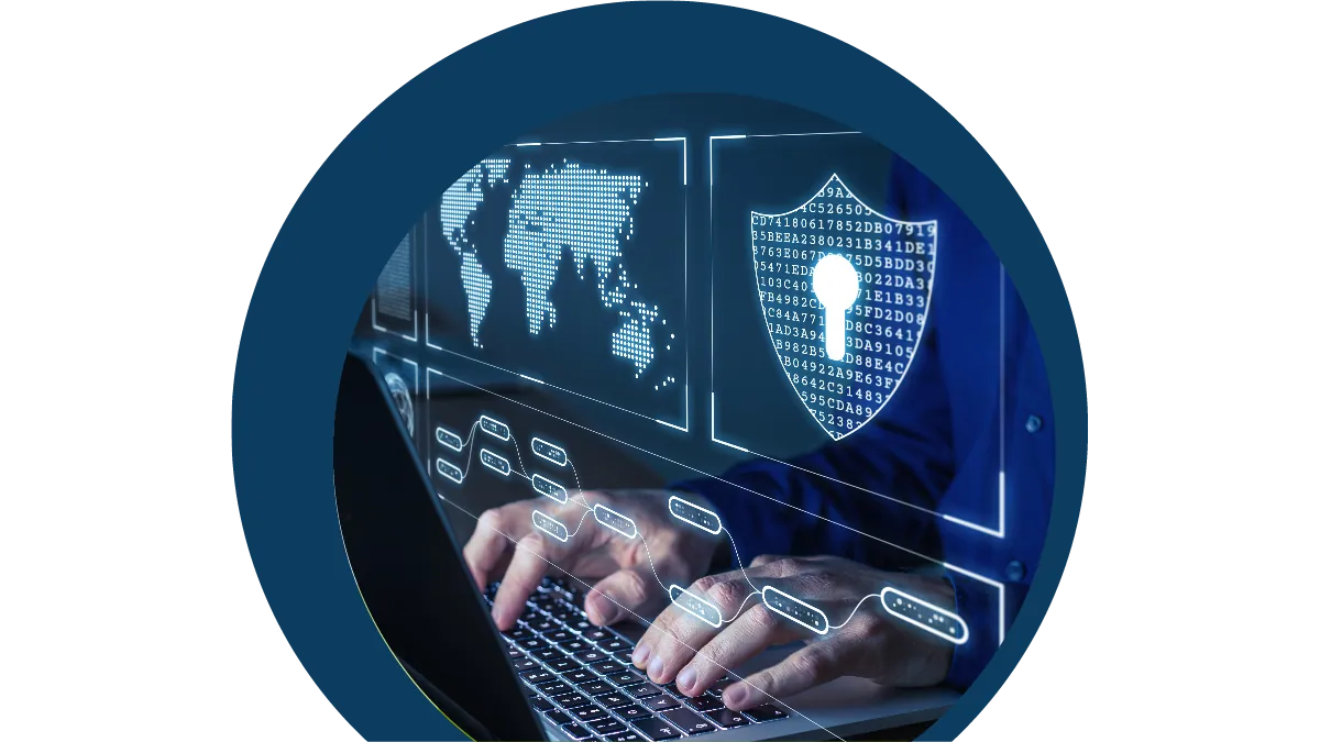 Hands typing on a laptop with holographic icons of a world map and a shield with a keyhole