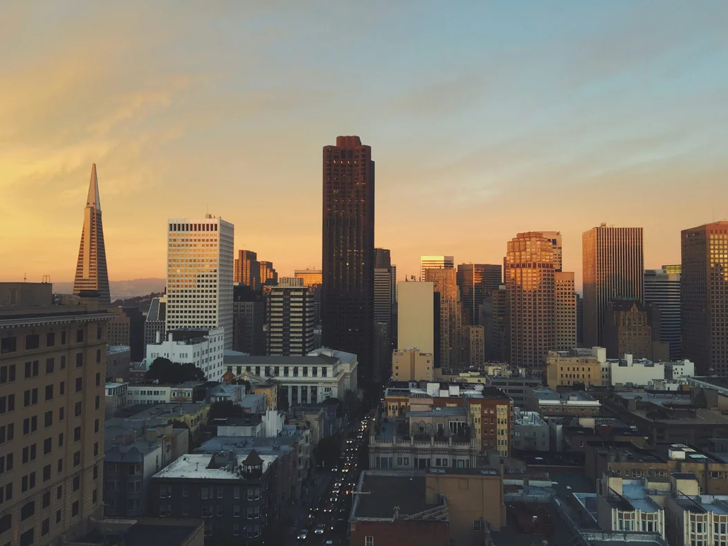 San Francisco skyline at sunset, with the Transamerica Pyramid and downtown high-rises